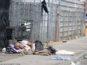 Protect CA - News - Image of a man sleeping on the sidewalk in broad daylight in Sacramento